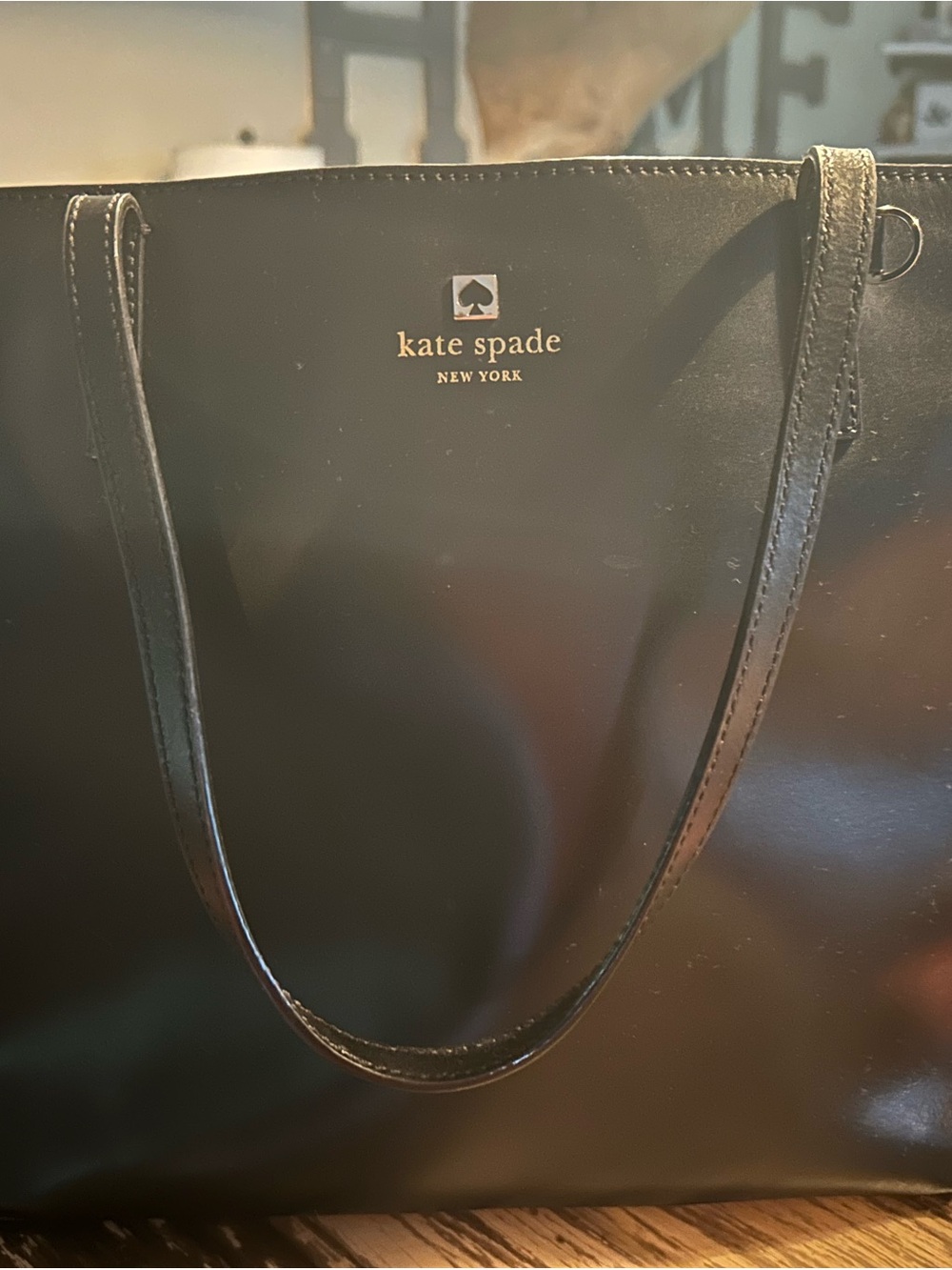 kate spade black leather tote with gold logo